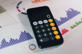 Calculator on graphs showing financial data and analytics. Ideal for business and finance themes.