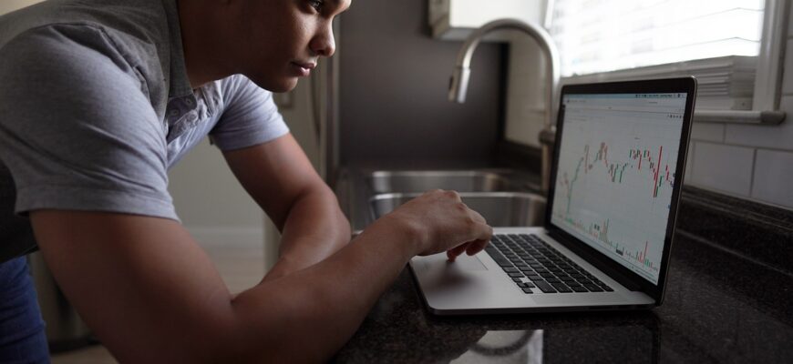 man, computer, stock trading