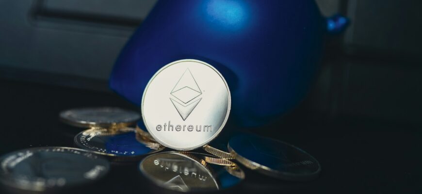 a blue ball sitting on top of a pile of coins