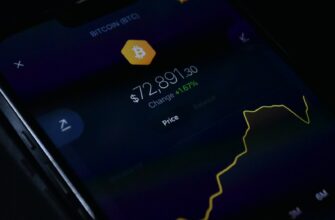 a close up of a cell phone with a bitcoin on it