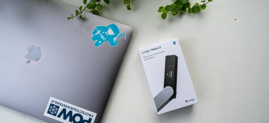 a laptop computer sitting on top of a white table