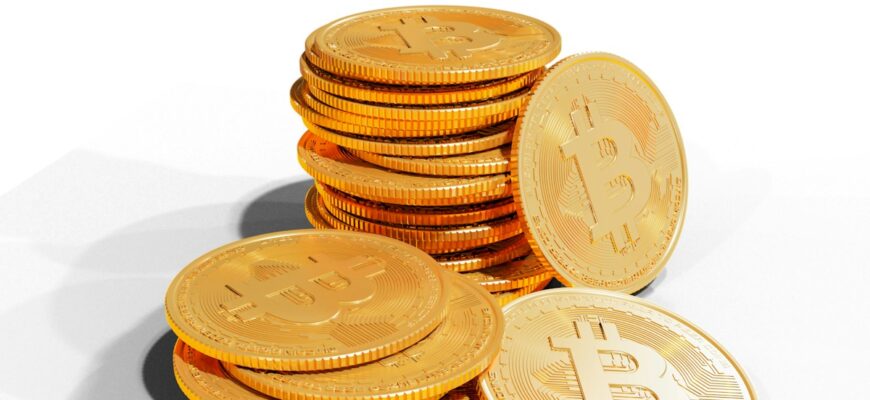 a pile of golden bitcoins sitting on top of each other