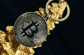 a golden keychain with a bitcoin on it