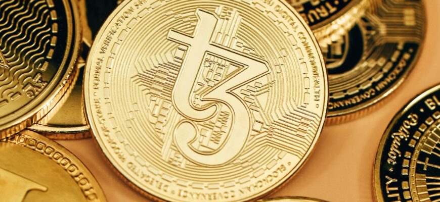 a pile of gold bitcoins sitting on top of each other