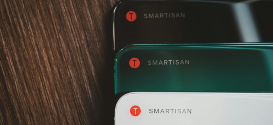 close-up photography of black, green, and white smartphnes